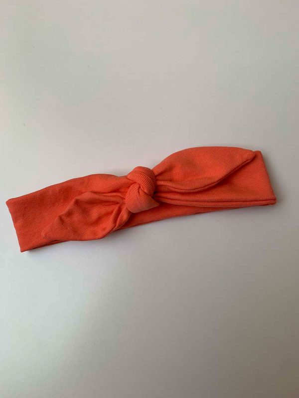 Knoophaarband met strik uni oranje